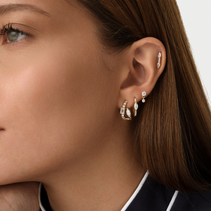 0.14 ctw 14K Gold Round Lab Grown Diamond Two-Stone Stud Earrings, worn on model