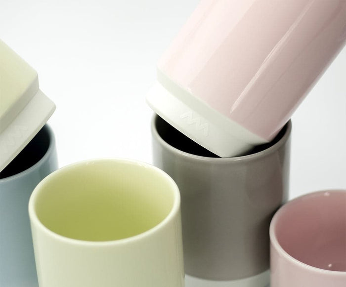 Asemi Hasami large cups in light grey shown alongside other colour variants, highlighting the glazed interiors.