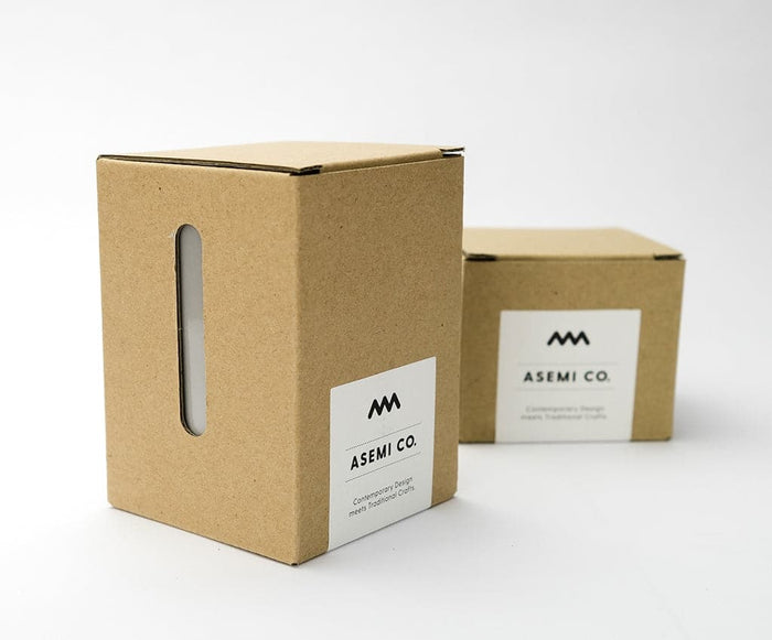 Asemi Hasami small light blue cups displayed alongside their cardboard packaging.