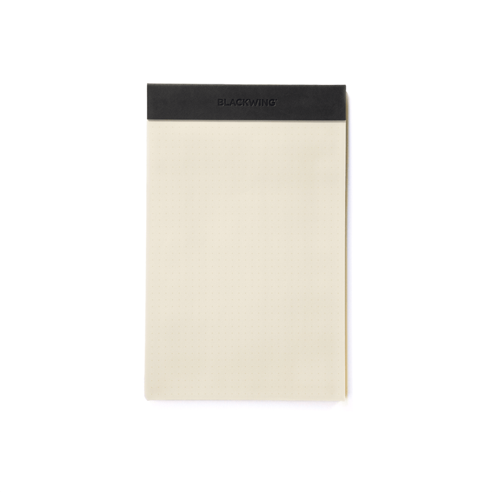 The Journal Shop - Blackwing A5 Legal Pad featuring cream grid paper with a sleek black binding strip at the top.