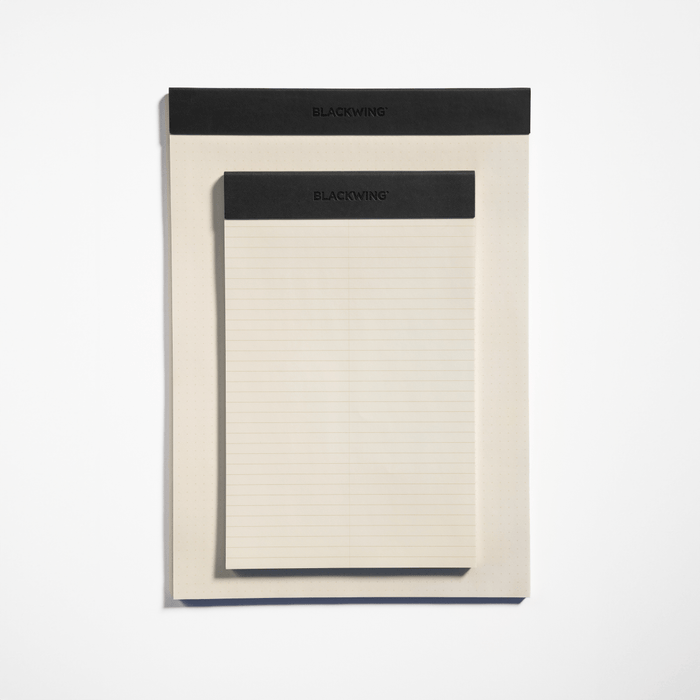 The Journal Shop - Single Blackwing A5 Legal Pad open flat to reveal lined writing paper beneath the black binding.