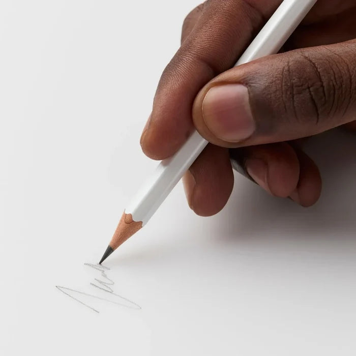 Hand writing with a Blackwing Pearl Balanced pencil on white paper