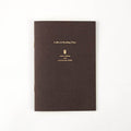 Front cover of the Daigo Teatime Reading Journal in dark brown with gold lettering.