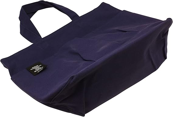 Flat base of the Delfonics Rollbahn Small Bag with visible front utility pockets and label detail.