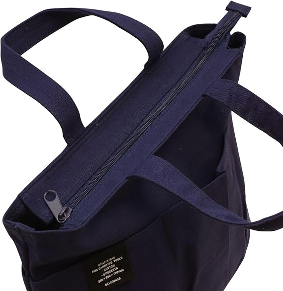 Top-down angle of the Delfonics Rollbahn Small Bag featuring a secure zip closure and sturdy handles.