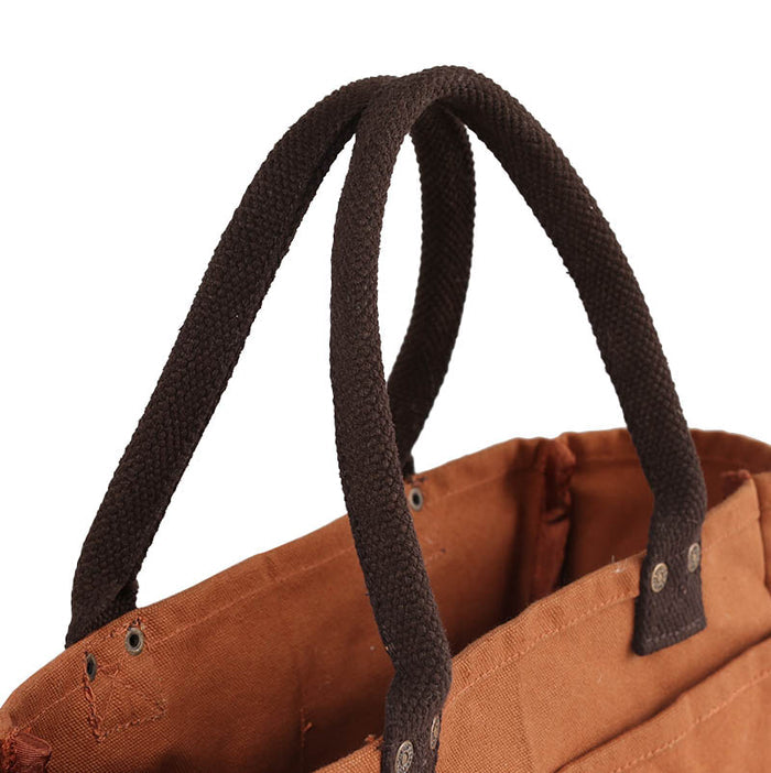 The Journal Shop - Close-up of a brown Dulton Canvas Shoulder Tote Bag showing its sturdy handles and durable canvas texture.