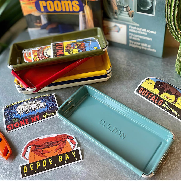 The Journal Shop - A variety of colourful Dulton Desktop Trays displayed on a work desk.