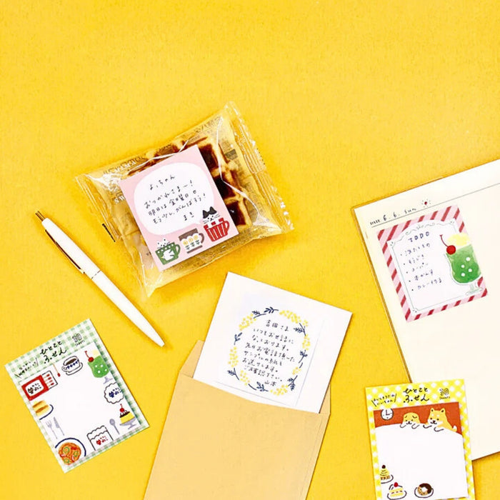 Furukawa Shiko One Word Fusen sticky notes arranged on a yellow background, showing assorted designs.