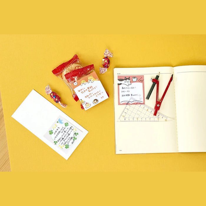 Furukawa Shiko One Word Fusen sticky notes styled with stationery on a bright yellow surface.