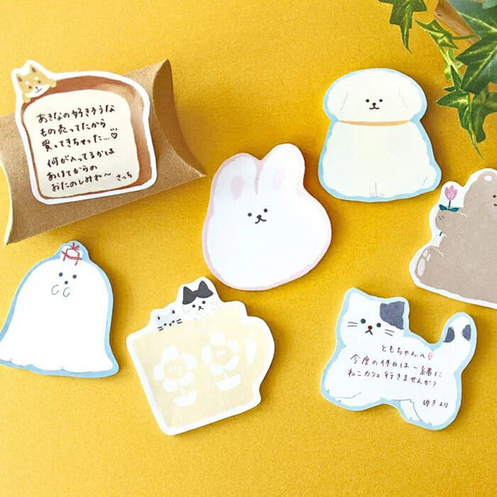 The Journal Shop - Assorted animal-shaped Furukawa Shiko sticky notes displayed on a yellow background, featuring designs like a cat, rabbit, and bear.