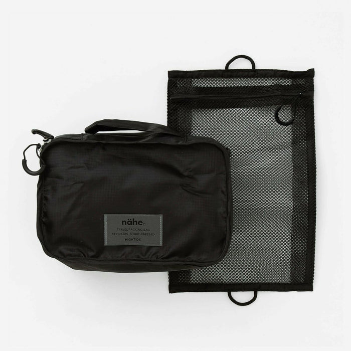 Black Nähe travel packing bag shown alongside matching black mesh zip pouch laid flat.