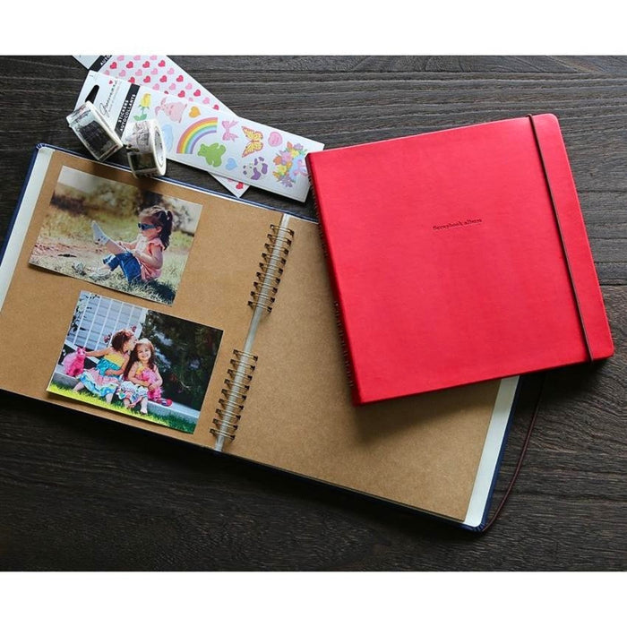 Hightide Penco Scrapbook Album khaki ring bound photo album displayed with photos and craft materials on a desk.
