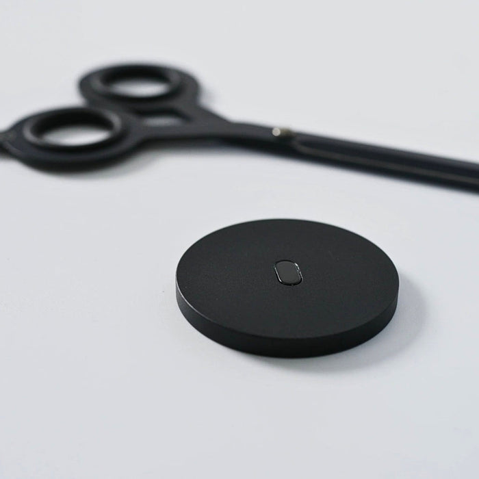 HMM Scissors Base aluminium stand in black with scissors placed beside showing compact form