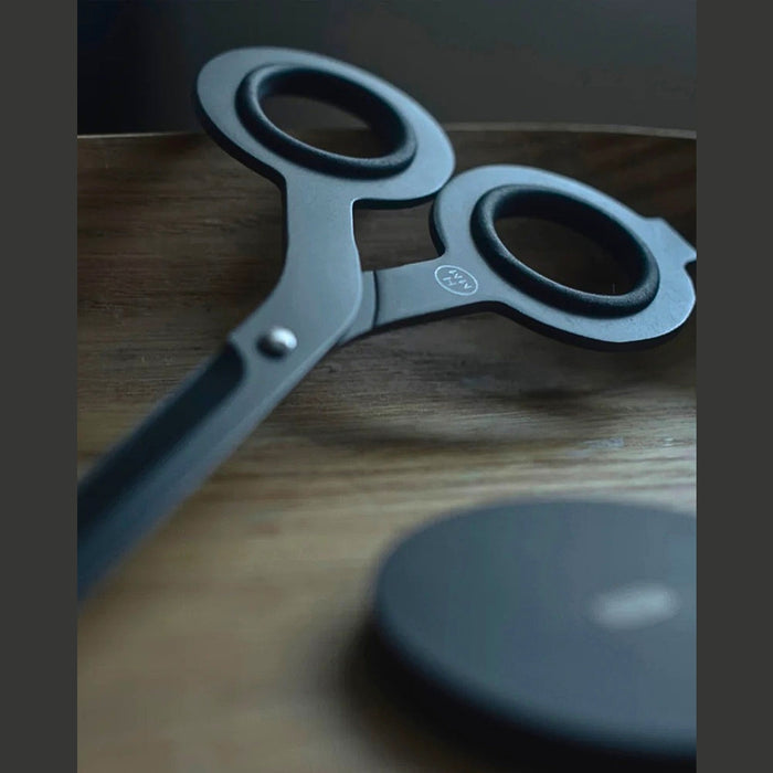 HMM Scissors Base aluminium stand in black holding scissors upright for tidy desk display