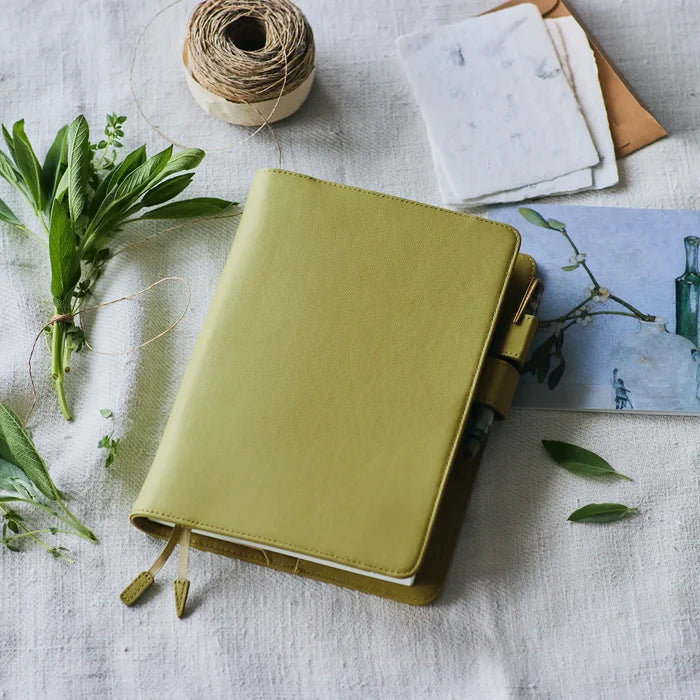 Hobonichi 2026 A5 Cousin Cover: Leather - Sage Green, detail view of the design.