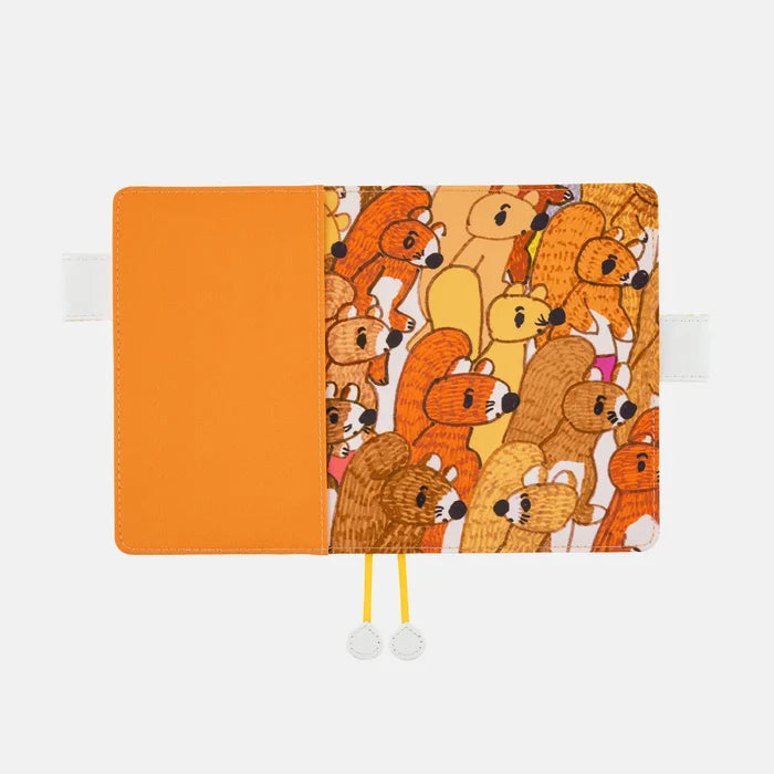 Hobonichi 2026 A6 Planner Cover: 100%ORANGE - Squirrel Squadron, shown from another angle.