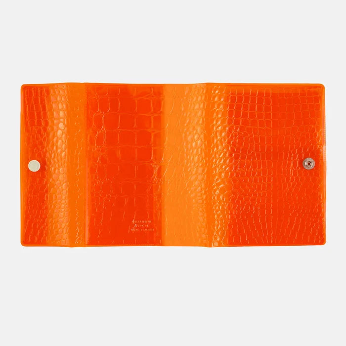 Hobonichi 2026 A6 Planner Cover: beautiful people - Nothing to Hide (Orange), shown from another angle.