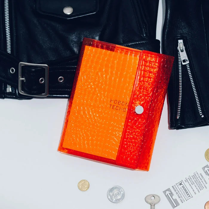 Hobonichi 2026 A6 Planner Cover: beautiful people - Nothing to Hide (Orange), detail view of the design.