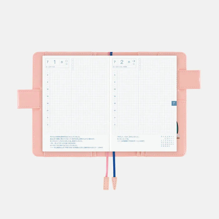 Hobonichi 2026 A6 Planner Cover: Candy Stripper - Random Dog & Cat (Pink), front view.