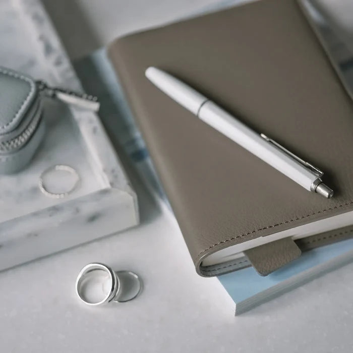 Hobonichi 2026 A6 Planner Cover: Leather - Taut (Gray & Light Blue), close-up view.
