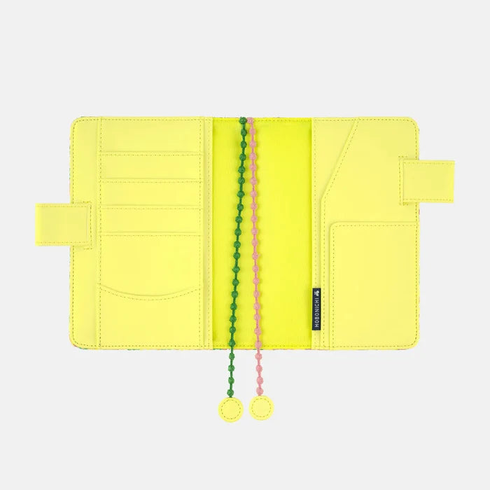 Hobonichi 2026 A6 Planner Cover: minä perhonen - skyful (Yellow), shown with its details.