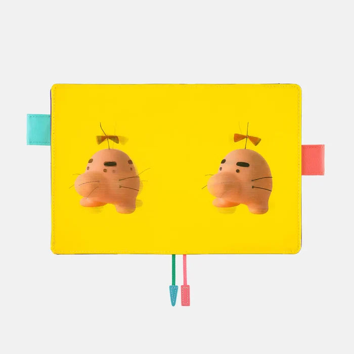 Hobonichi 2026 A6 Planner Cover: MOTHER - Mr. Saturn (It’s Great), shown from another angle.