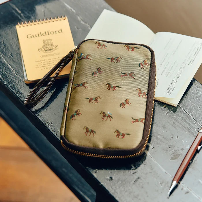 Hobonichi 2026 Accessories: Small Drawer Pouch (Bow & Tie - Galloping Horses), detail view of the design.