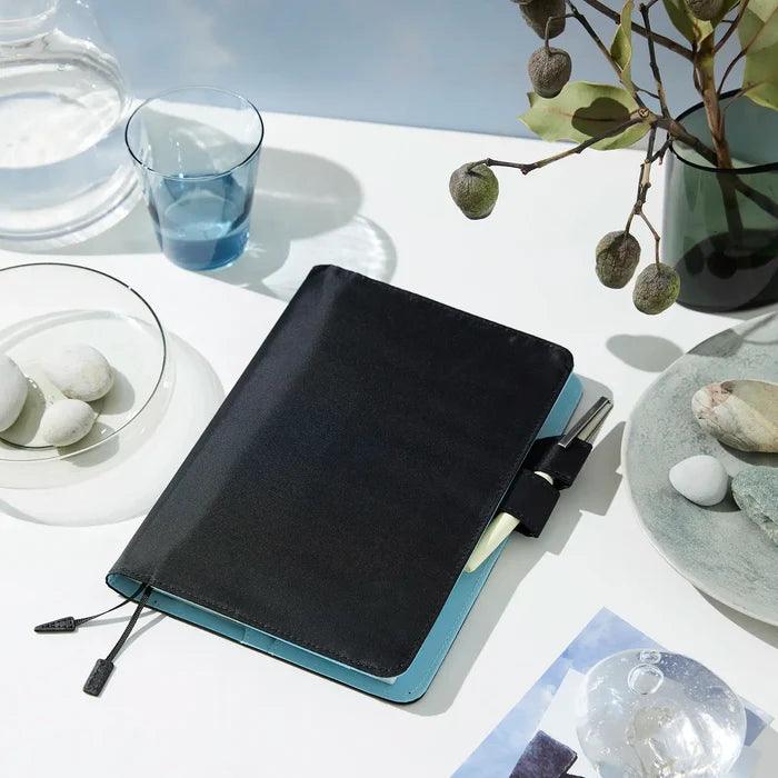 Hobonichi 2026 A5 Cousin Cover: Colors - Black x Clear Blue, detail view of the design.