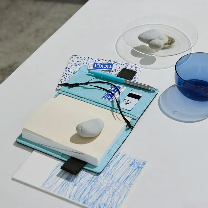 Hobonichi 2026 A6 Planner Cover: Colors - Black x Clear Blue, shown with its details.