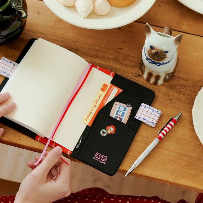 Hobonichi 2026 A6 Planner Cover: Yumi Kitagishi - White Cat's Table Decorations, close-up view.