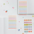 Hobonichi 2026 Accessories: TSUKI no IRO - Transparent Dot Stickers (6mm), shown from the front.