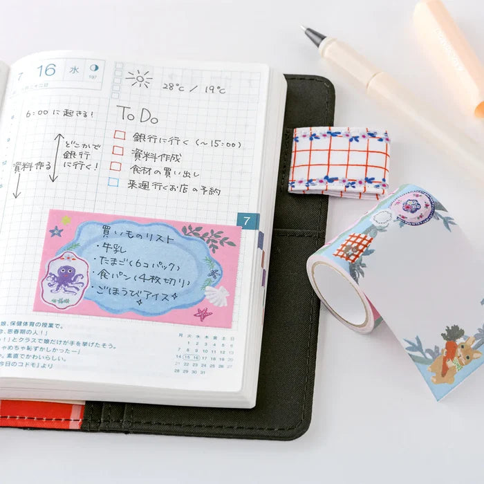 Hobonichi 2026 Accessories: Yumi Kitagishi - Sticky Note Roll - White Cat’s Table Decorations, detail view of the design.