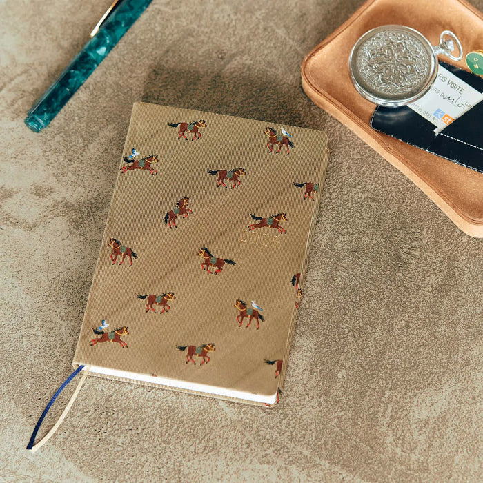 Hobonichi HON A6 2026 Planner: Bow & Tie - Galloping Horses, detail view of the design.