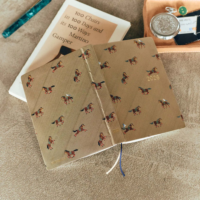 Hobonichi HON A6 2026 Planner: Bow & Tie - Galloping Horses, shown in full.