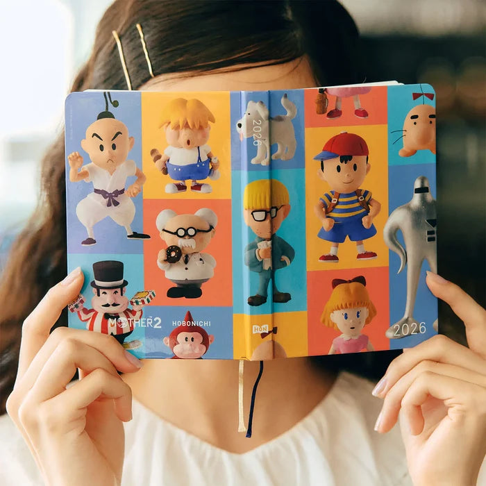 Hobonichi HON A6 2026 Planner: MOTHER - Clay Figurines, close-up view.