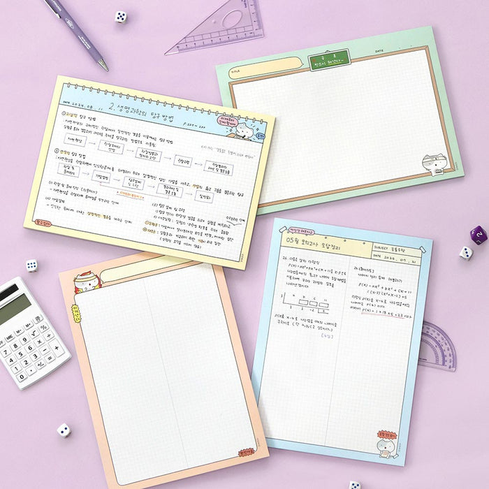 The Journal Shop - Iconic Blah Blah B5 Memo Notepads in assorted pastel colours displayed on desk with stationery.