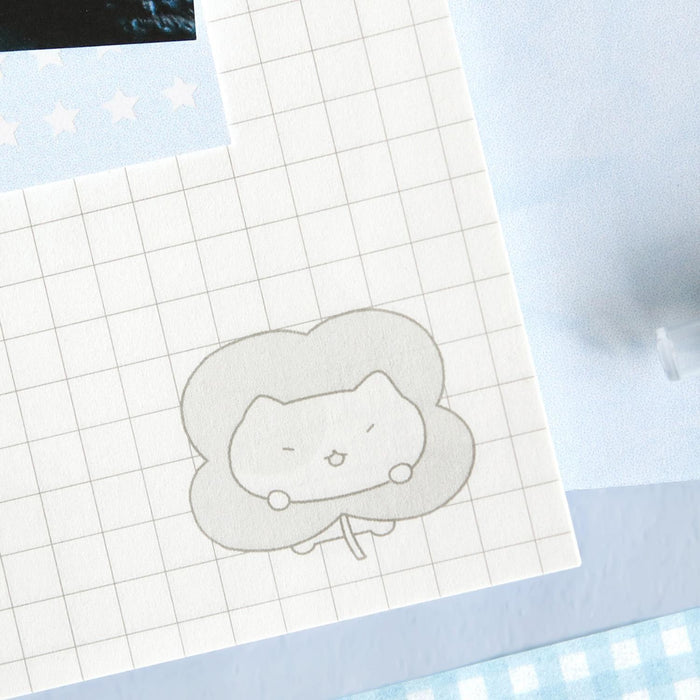 The Journal Shop - Iconic Blah Blah B5 Spiral Grid Notebook close-up of grid paper with doodle illustration in the corner.