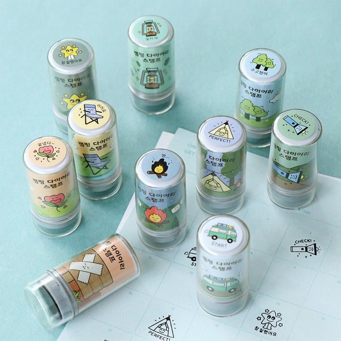 The Journal Shop - Collection of Iconic Camping Diary Stamps in assorted pastel colours displayed on a light blue surface.