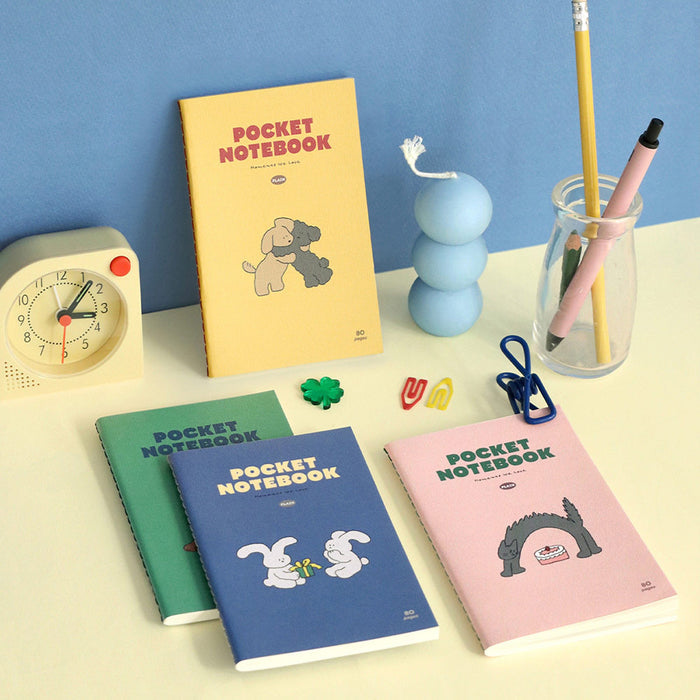 Iconic Charming Handy Pocket Notebook v.3 plain notebooks arranged on a desk with stationery accessories.