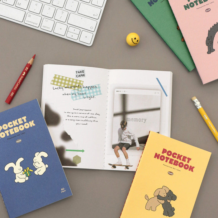 Iconic Charming Handy Pocket Notebook v.3 plain shown in a creative workspace with pens and paper.