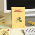 Single Iconic Charming Handy Pocket Notebook v.3 plain placed on a desk.