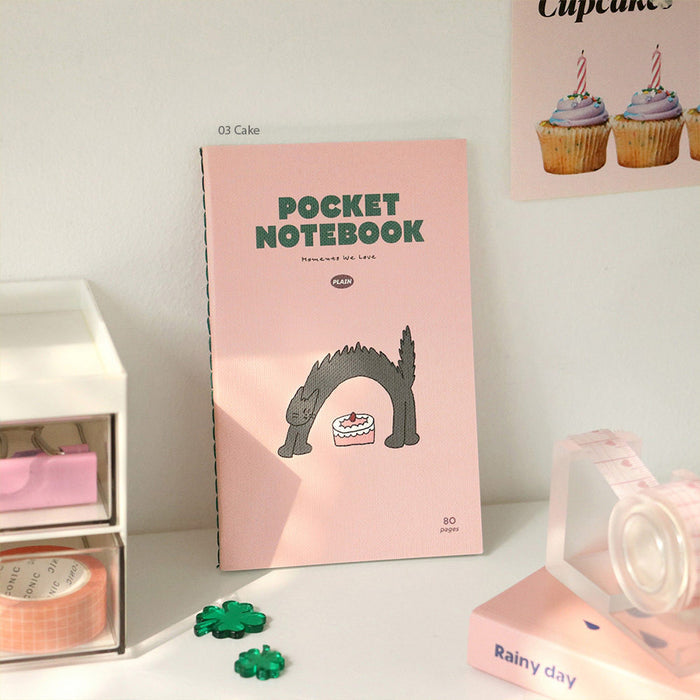 Styled display of Iconic Charming Handy Pocket Notebook v.3 plain with decorative stationery.