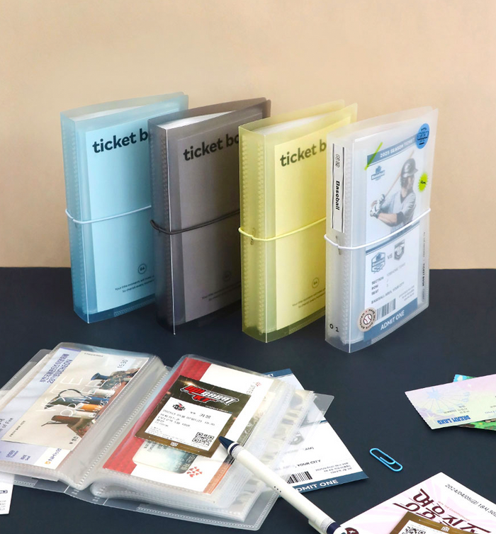 The Journal shop - Iconic Collect Ticket Book 64 pockets in assorted colours with tickets and stickers displayed.