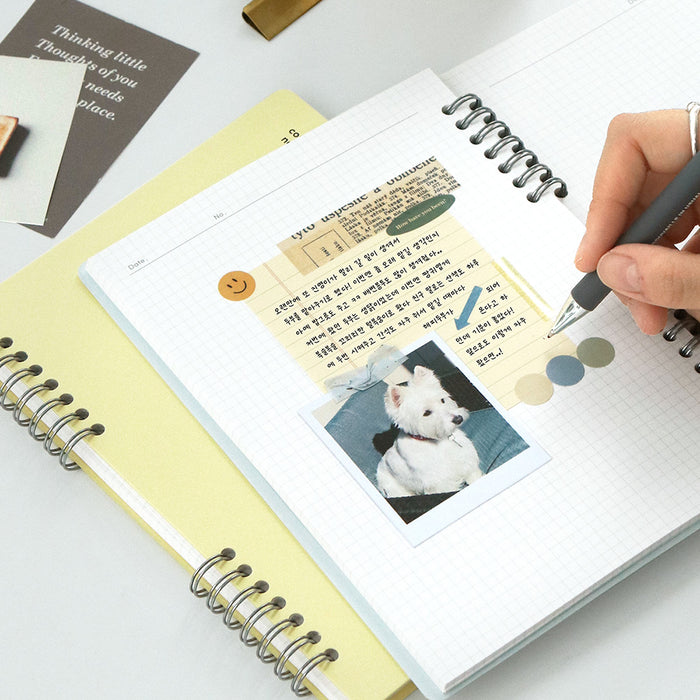 Detailed view of the grid-lined page inside the Iconic Compact A5 Grid Notebook.