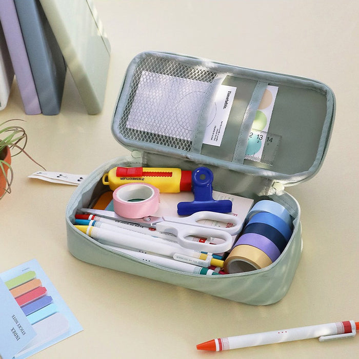 The Journal Shop - Open Teal Green pen pouches showing compartments filled with pens, scissors, and accessories.