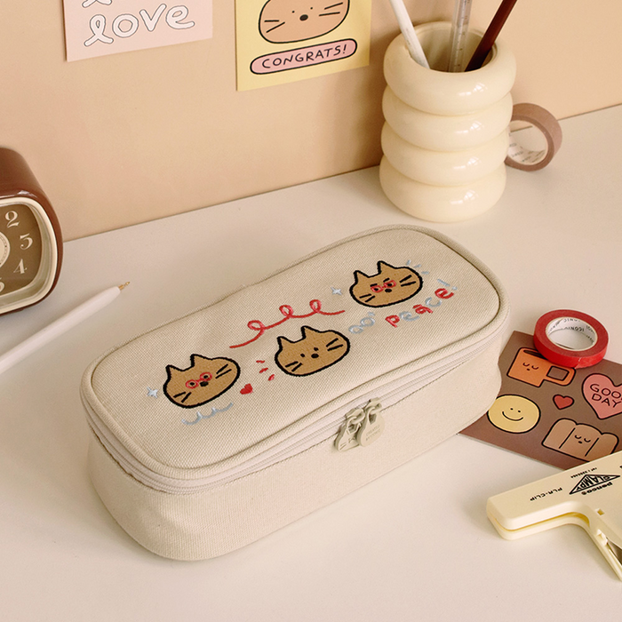 The Journal Shop - Iconic Doodle Large Capacity Pen Pouch cream design with doodle characters shown on beige background.