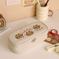 The Journal Shop - Iconic Doodle Large Capacity Pen Pouch cream design with doodle characters shown on beige background.