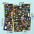 The Journal Shop - Collection of Iconic Doodle Removable Sticker sheets in various designs displayed on a light blue surface.