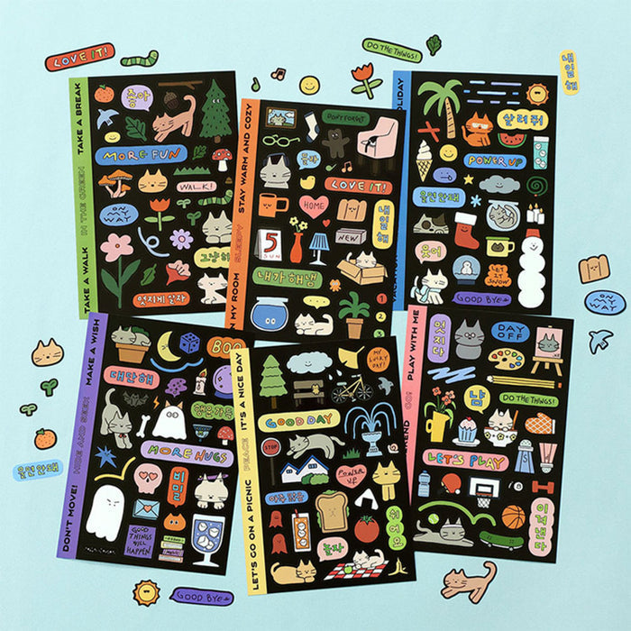 The Journal Shop - Collection of Iconic Doodle Removable Sticker sheets in various designs displayed on a light blue surface.