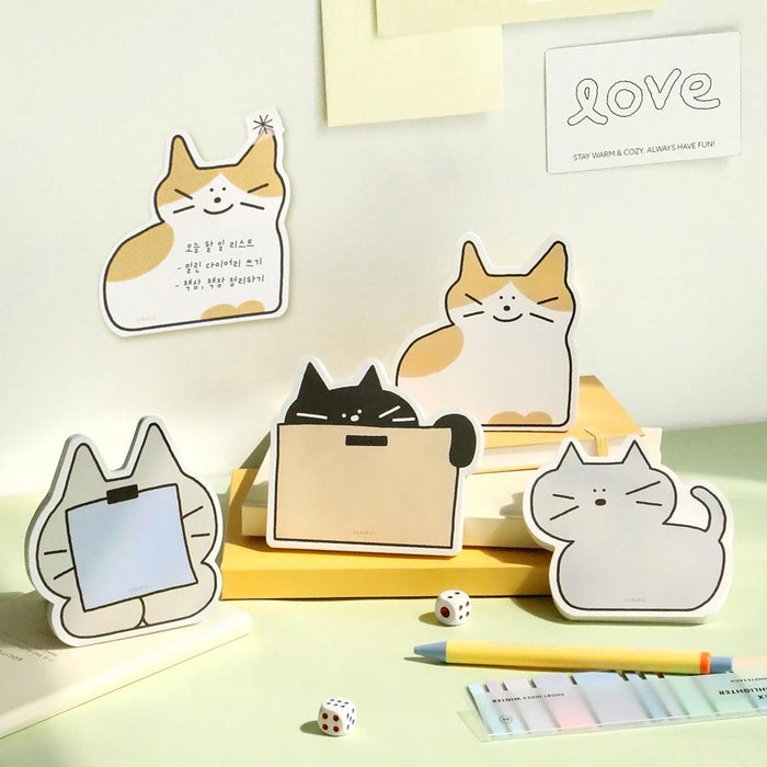The Journal Shop - Iconic Doodle Memo Pad cute tear-off notepads displayed in assorted pastel designs with cartoon illustrations.